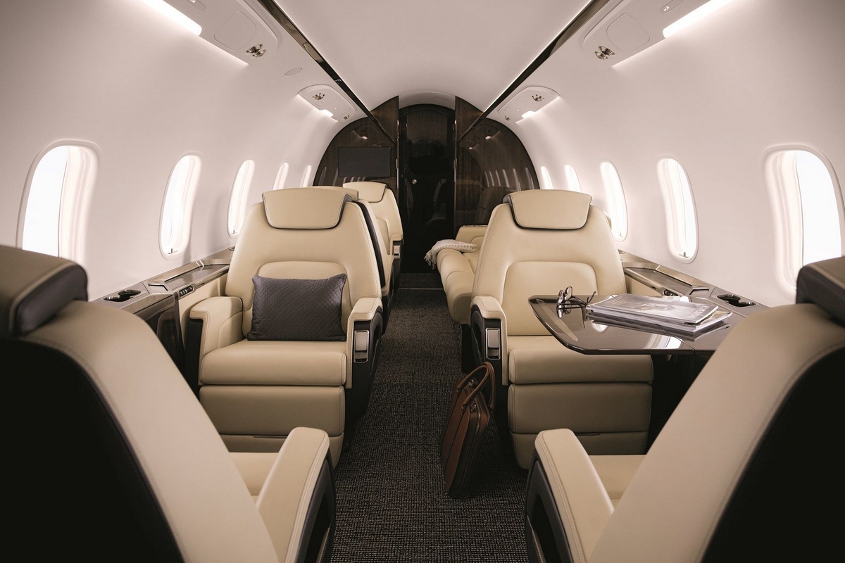 Bombardier Challenger 350 Interior Challenger 350 cabin with cream leather seats and a folding table