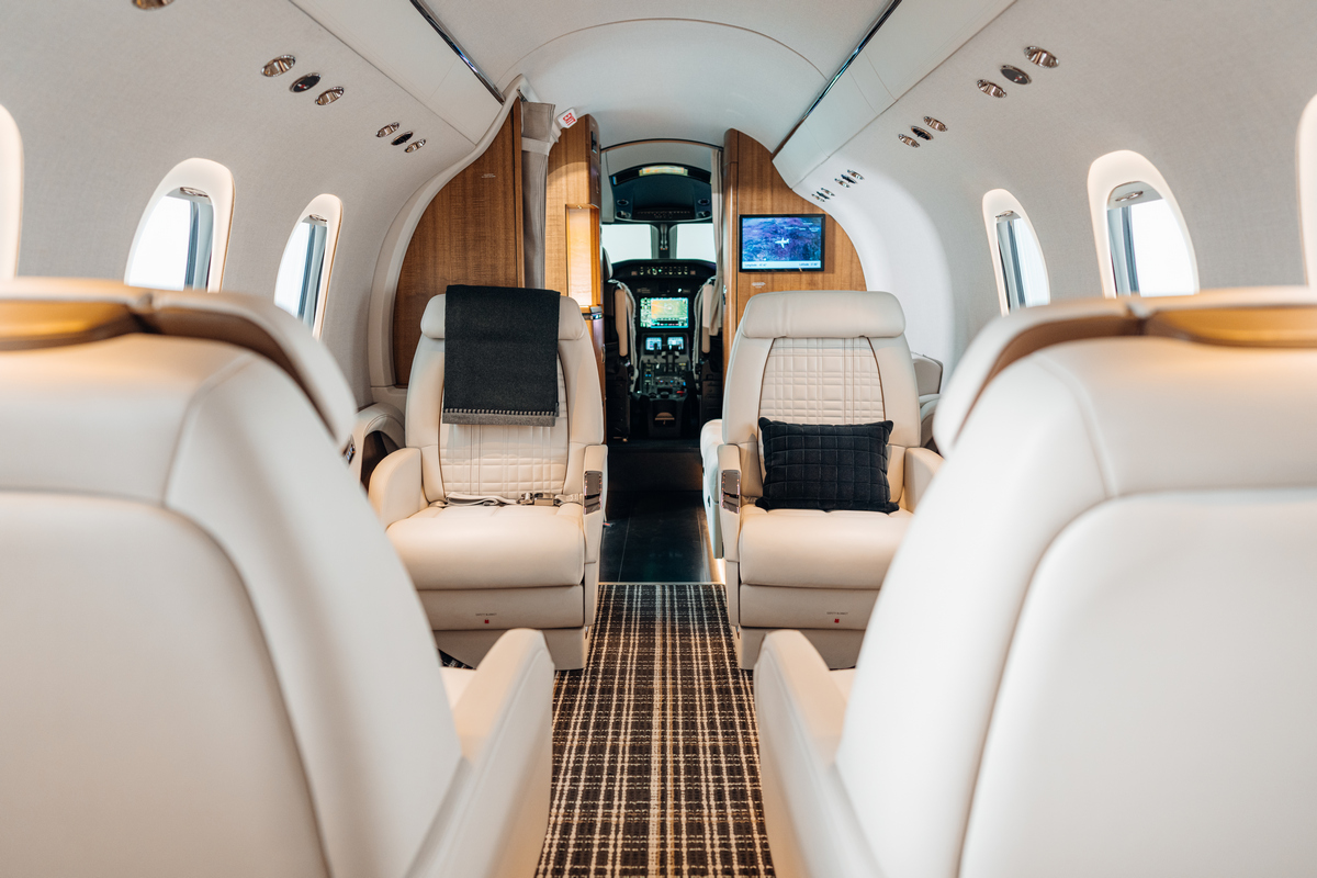 Cessna Citation Latitude Interior Cessna Citation Latitude cabin with cream leather seats and a central aisle